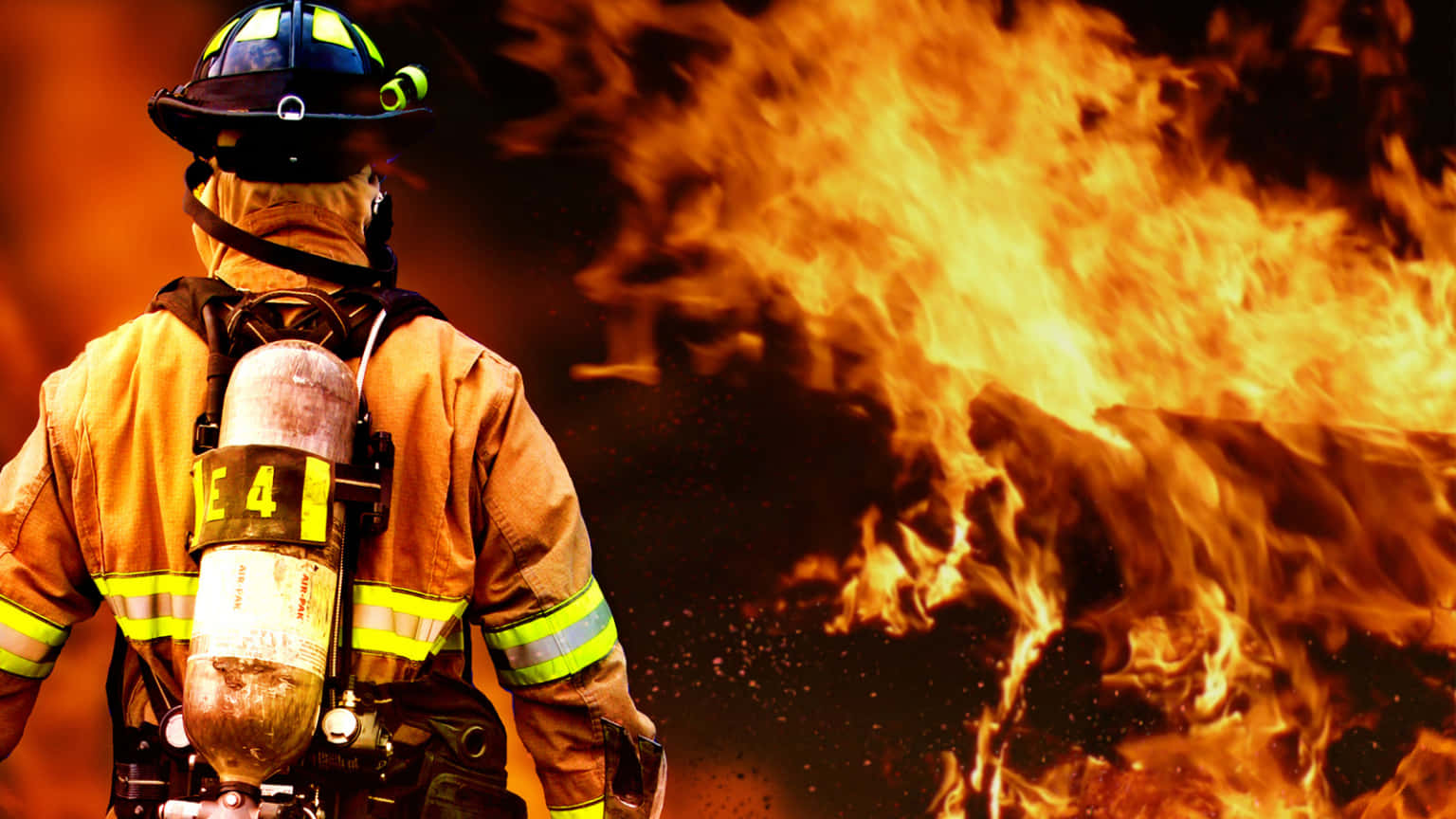 A Firefighter Is Standing In Front Of A Fire