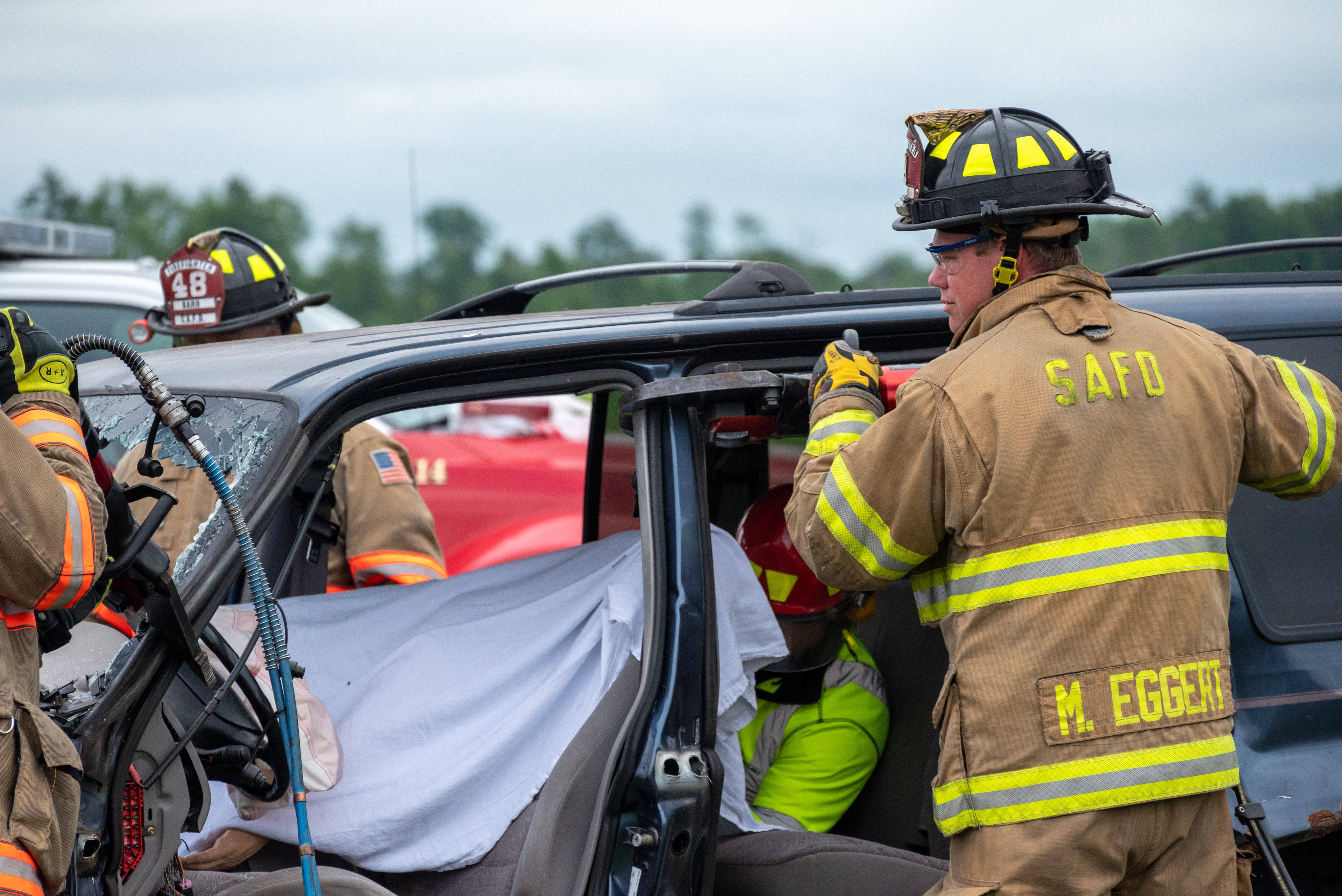 Firefighters At Car Accident Wallpaper