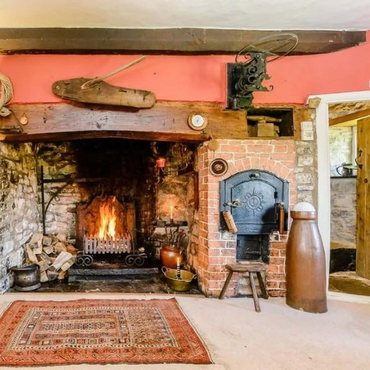 A Fireplace In A Room With A Rug And A Fireplace