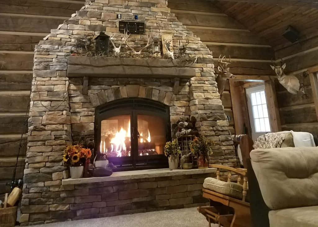 A cozy and inviting living room with a stone fireplace