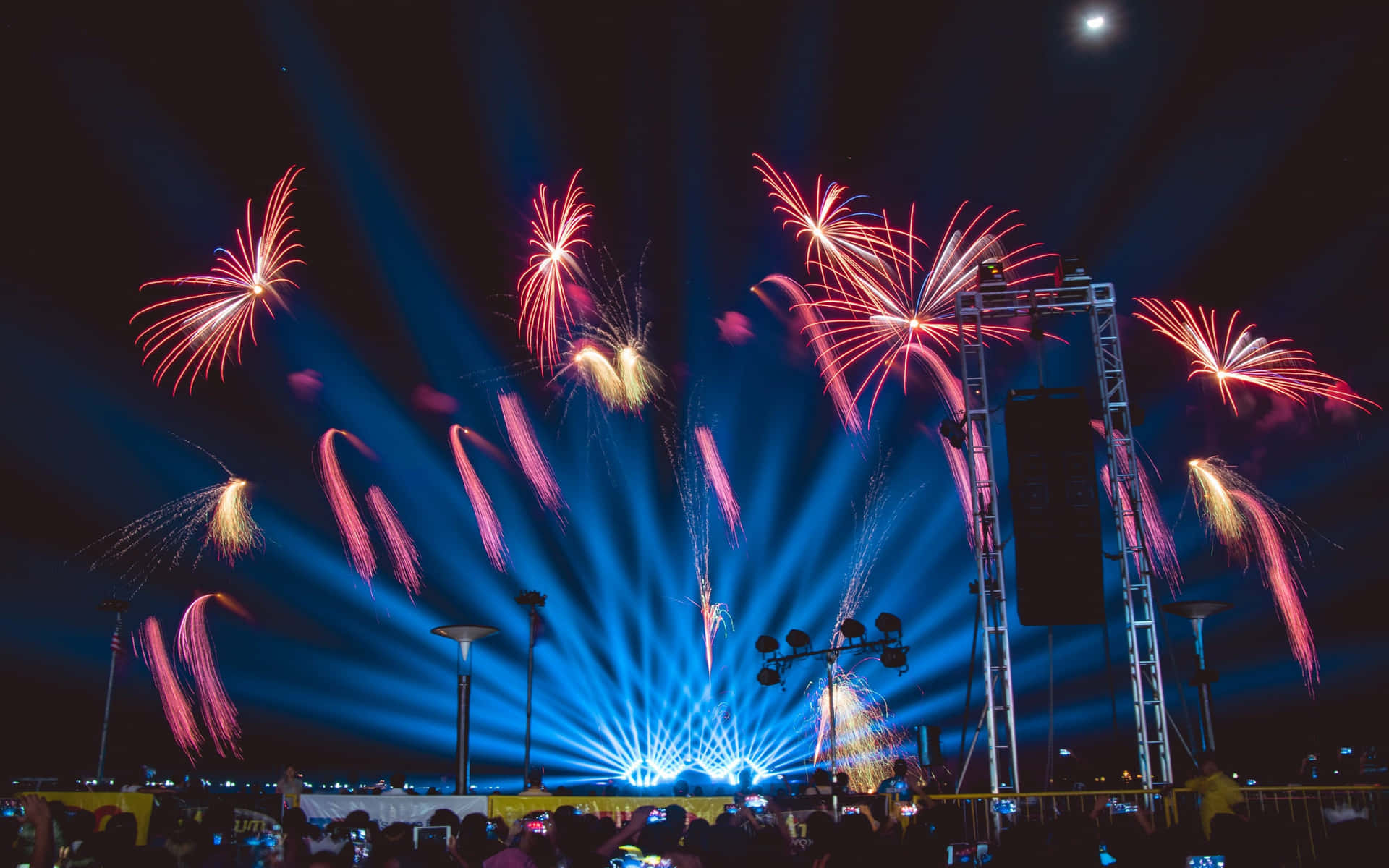 Red Fireworks With Blue Stage Lights Picture