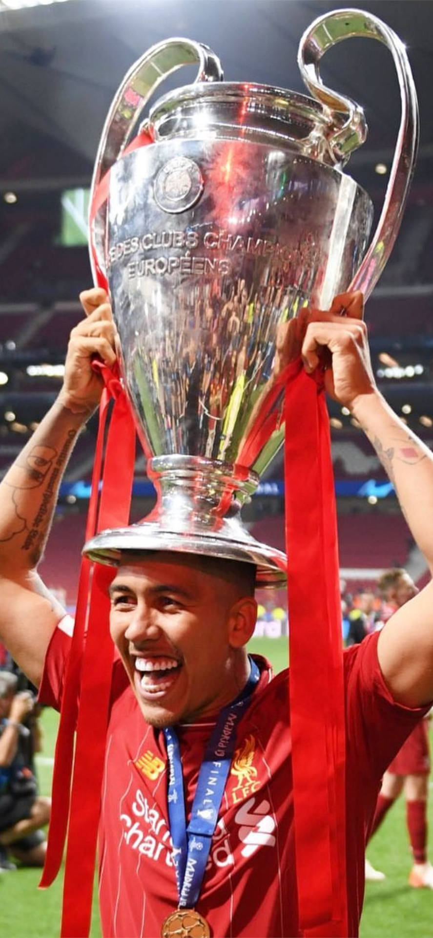 Firmino Holding Champions League Trophy Wallpaper