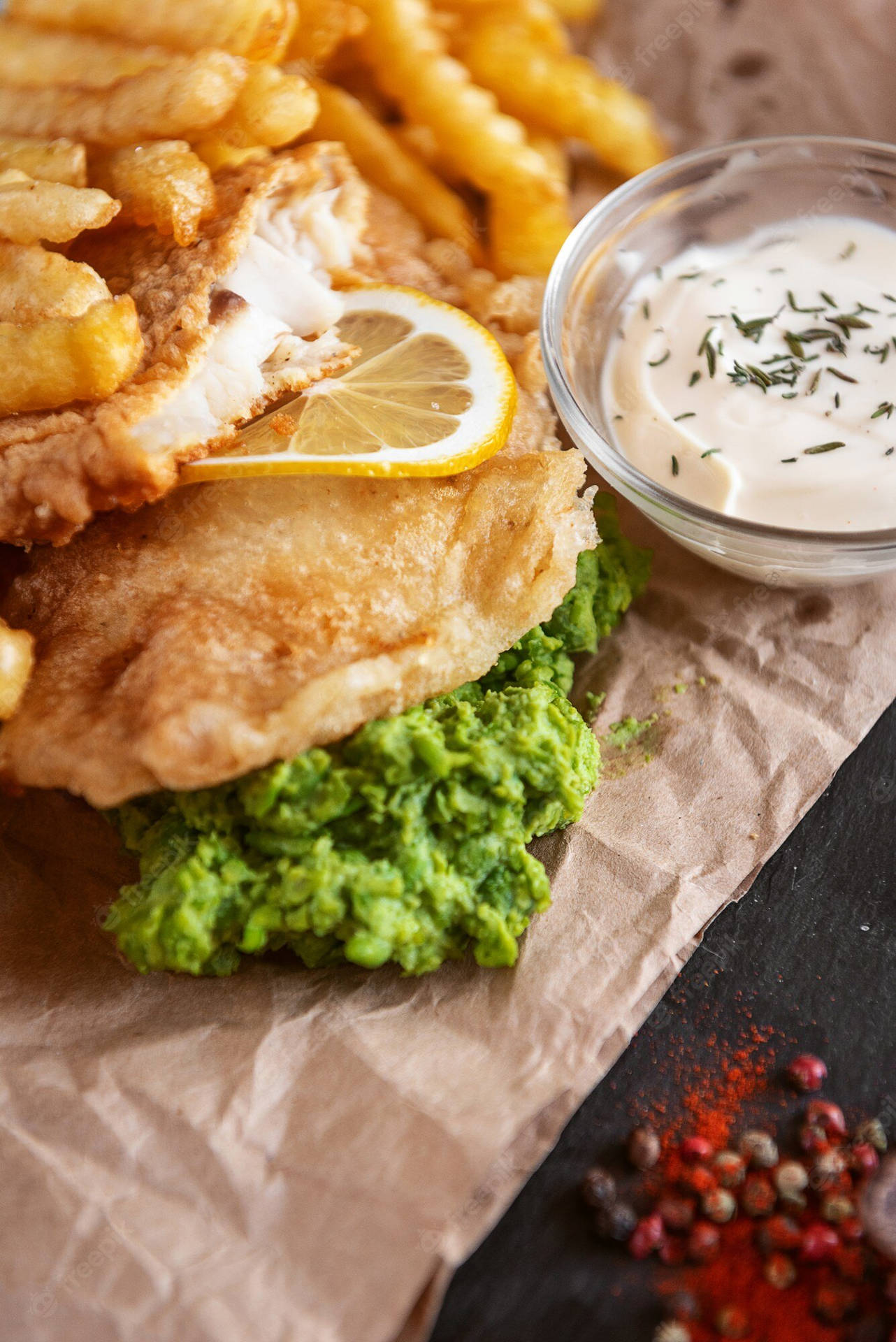 Fish And Chips On A Brown Paper Sheet Wallpaper