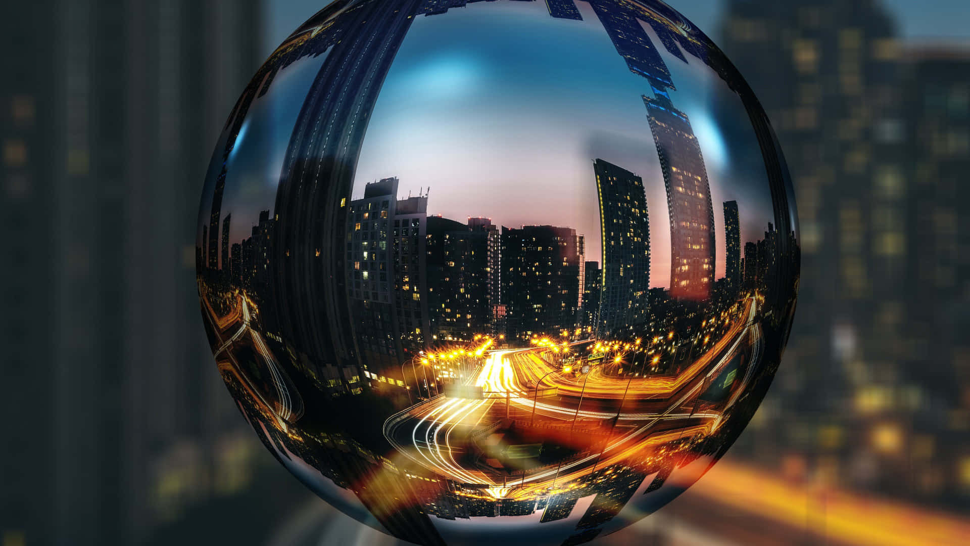 A Ball With A City In The Background
