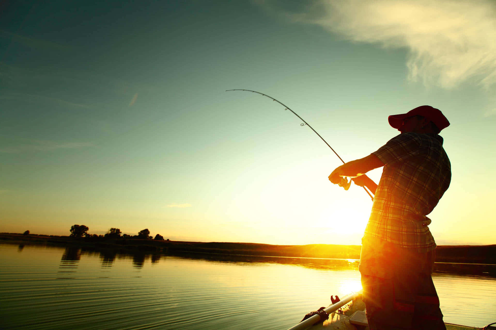 A fishing rod poised for the perfect catch Wallpaper
