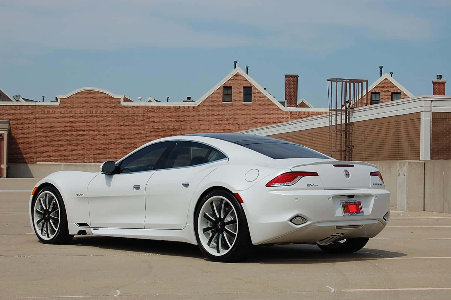 Sleek Fisker electric vehicle parked outdoors Wallpaper