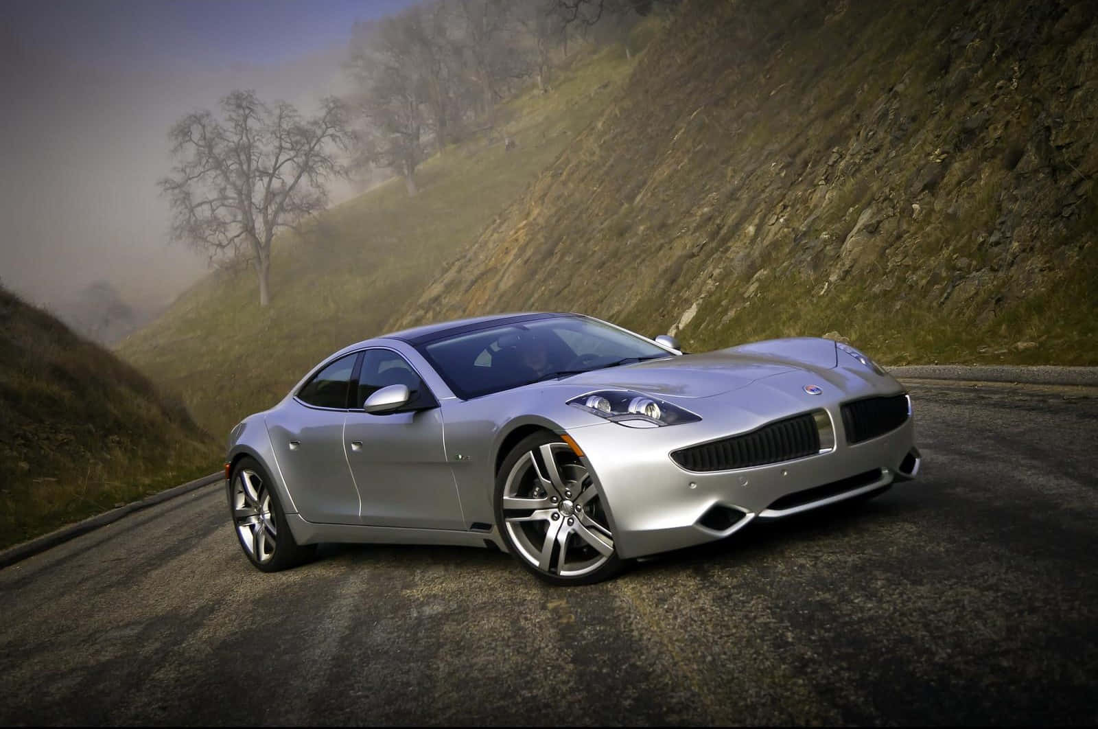 Fisker electric vehicle parked in a modern urban setting Wallpaper