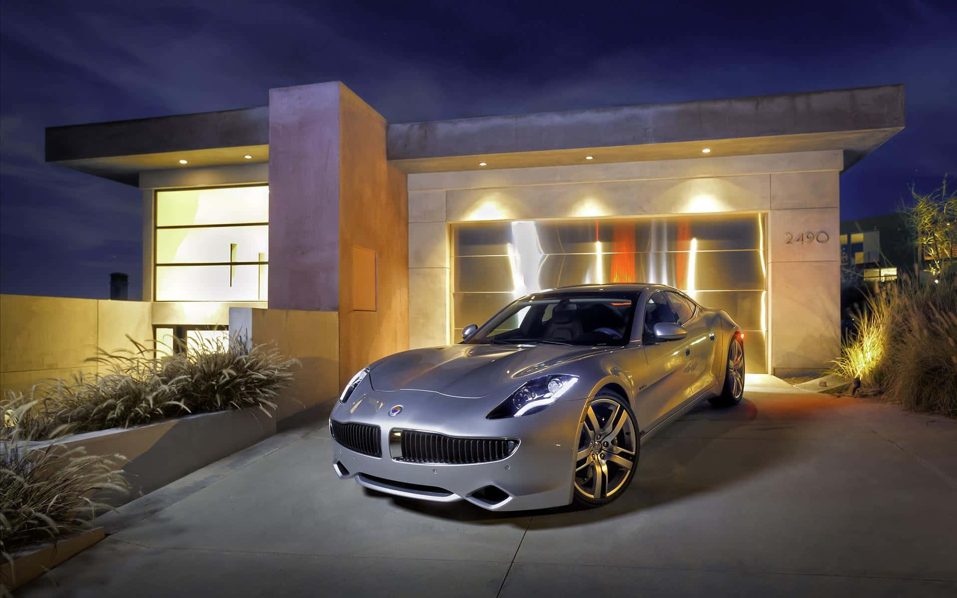 Sleek Fisker electric vehicle charging at sunset Wallpaper