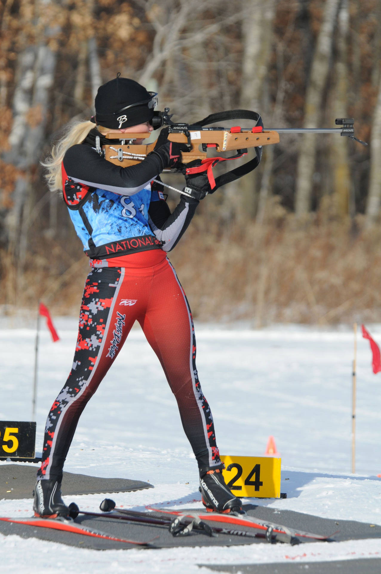 Fit Female Biathlon Athlete Rifle Shooting Segment Wallpaper