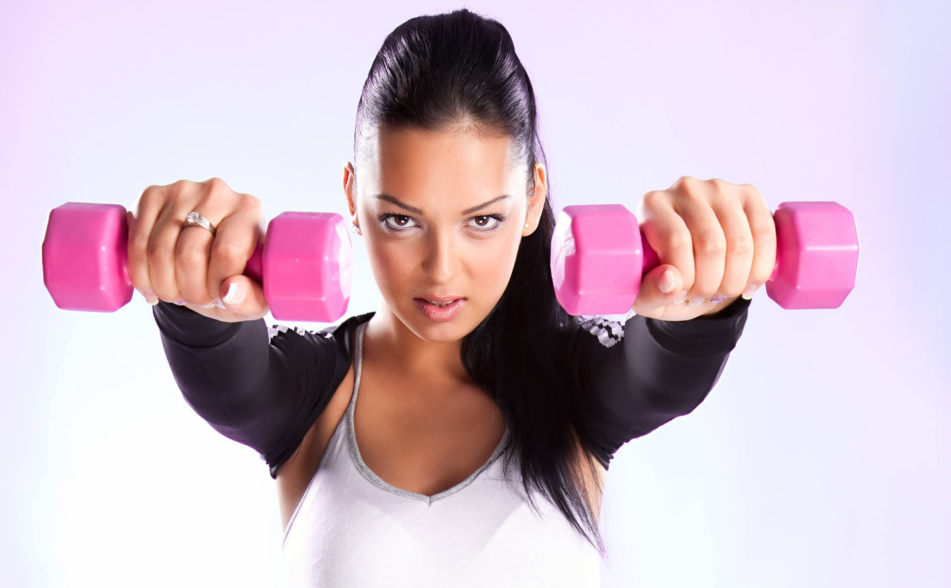 Fit Woman Holding Pink Dumbbells Wallpaper