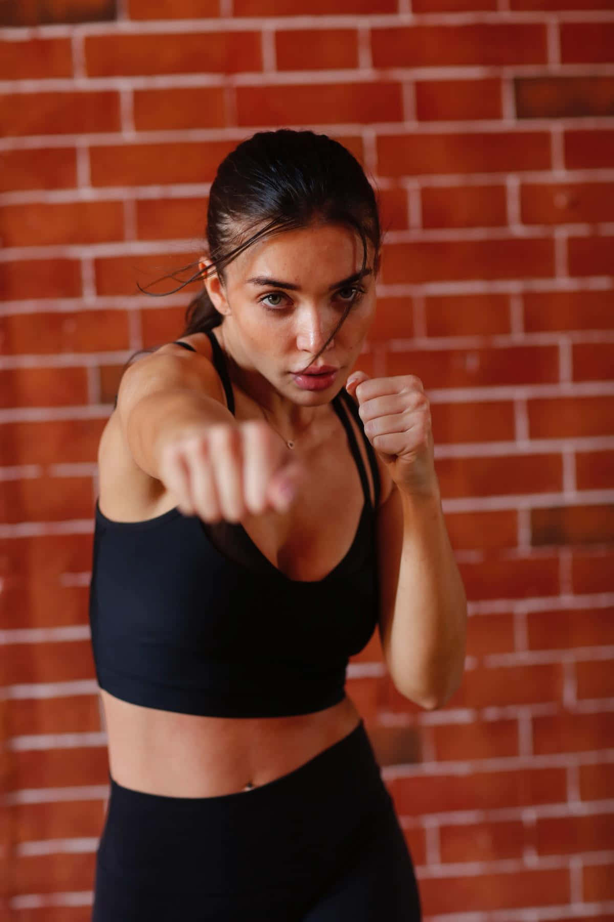 Fitness Enthusiast Boxing Pose Wallpaper