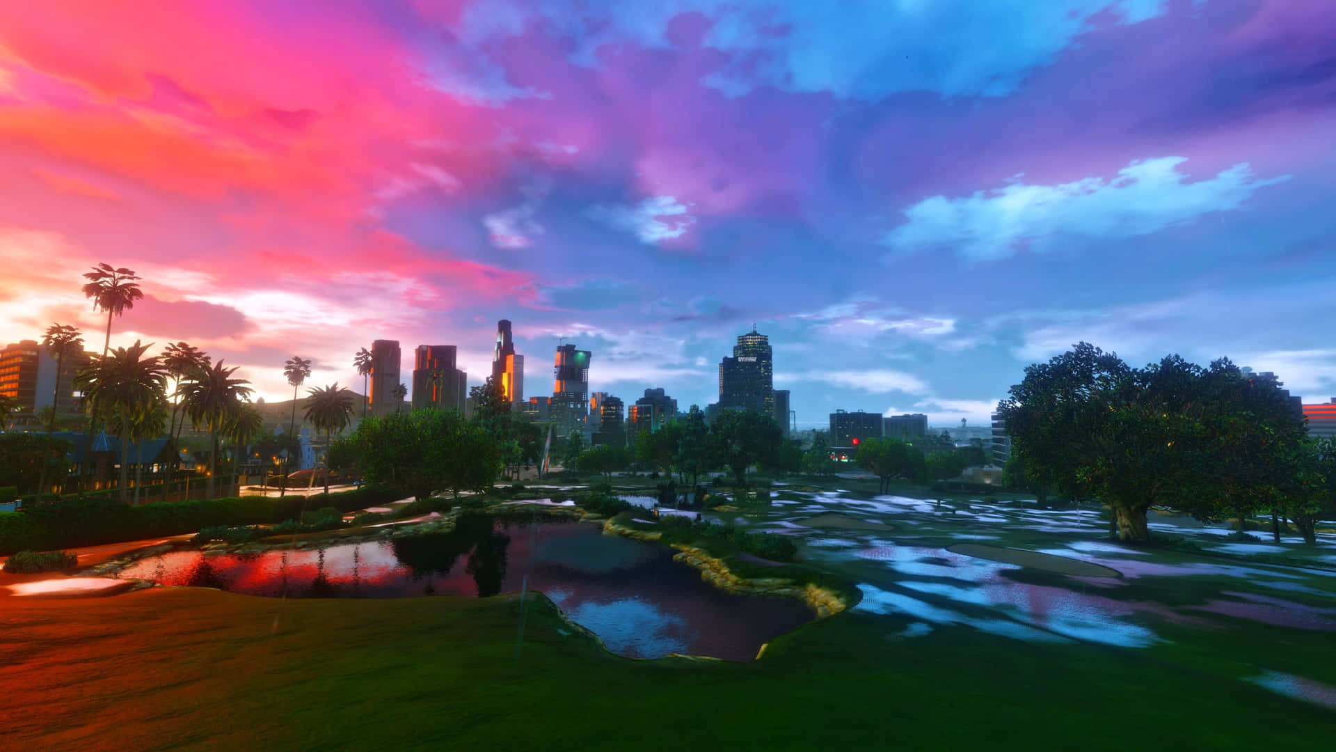 A Colorful Sunset Over A City With A Pond Wallpaper