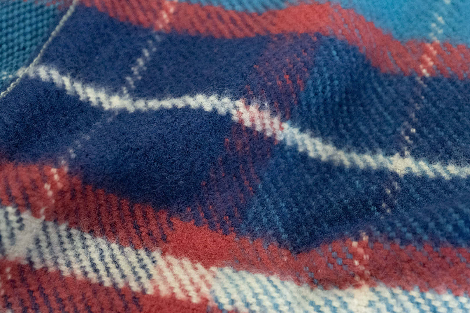 a close up of a plaid blanket