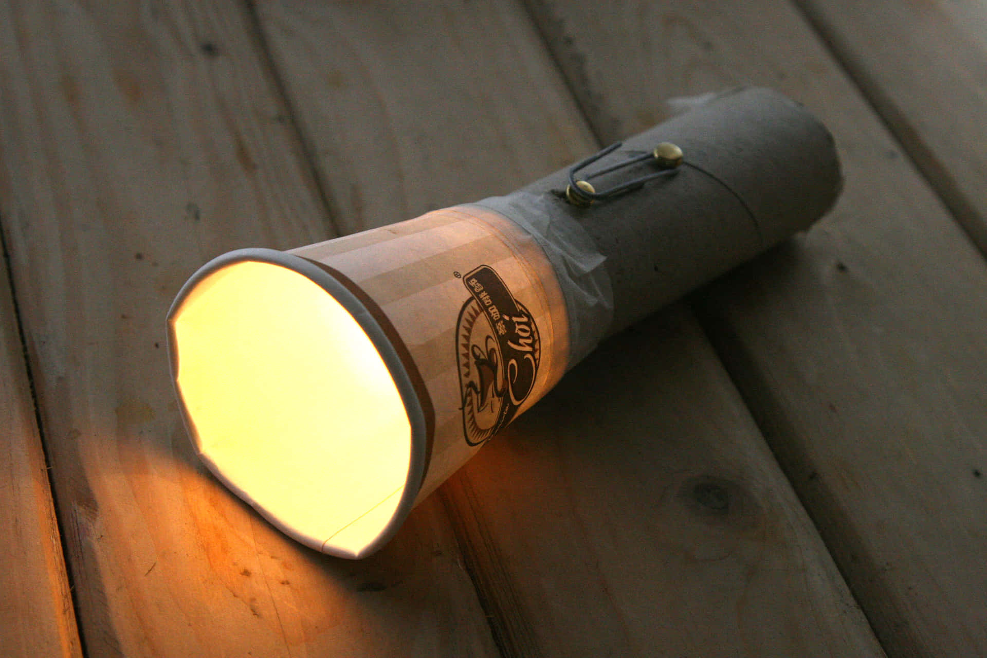 A Light Bulb On A Wooden Table