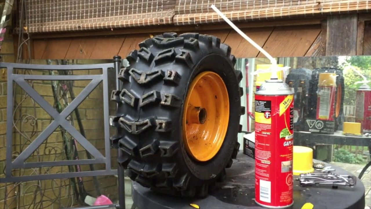 A Tire With A Spray Can And A Tire