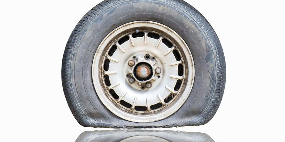 A Tire With A Flat Tire On It