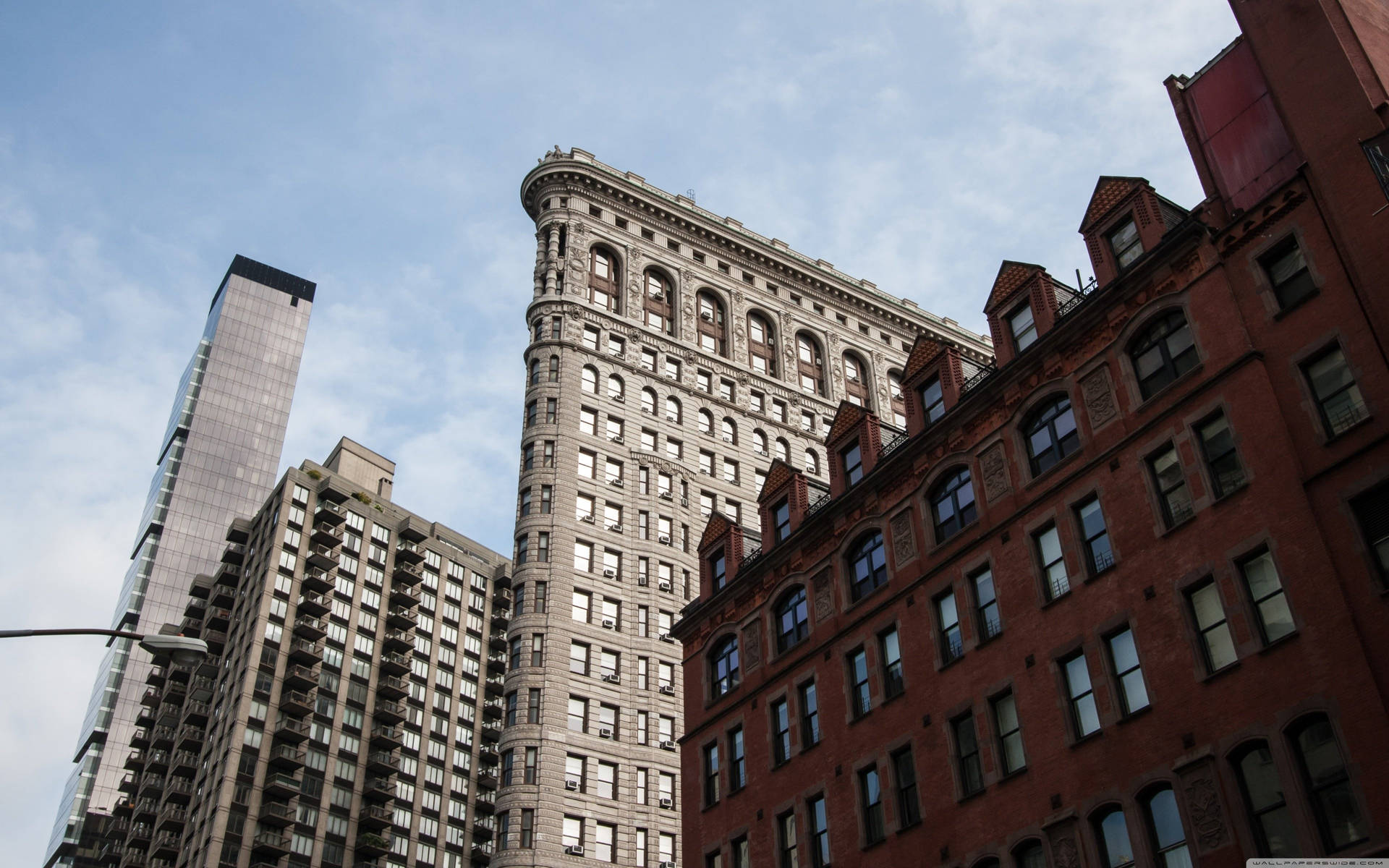 Flatiron Building Surrounded By Buildings Wallpaper