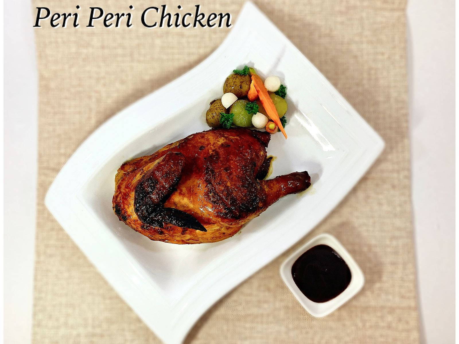 Designe Desktop Wallpaper med et velsmagende grillede Peri Peri-kyllingemåltid. Wallpaper