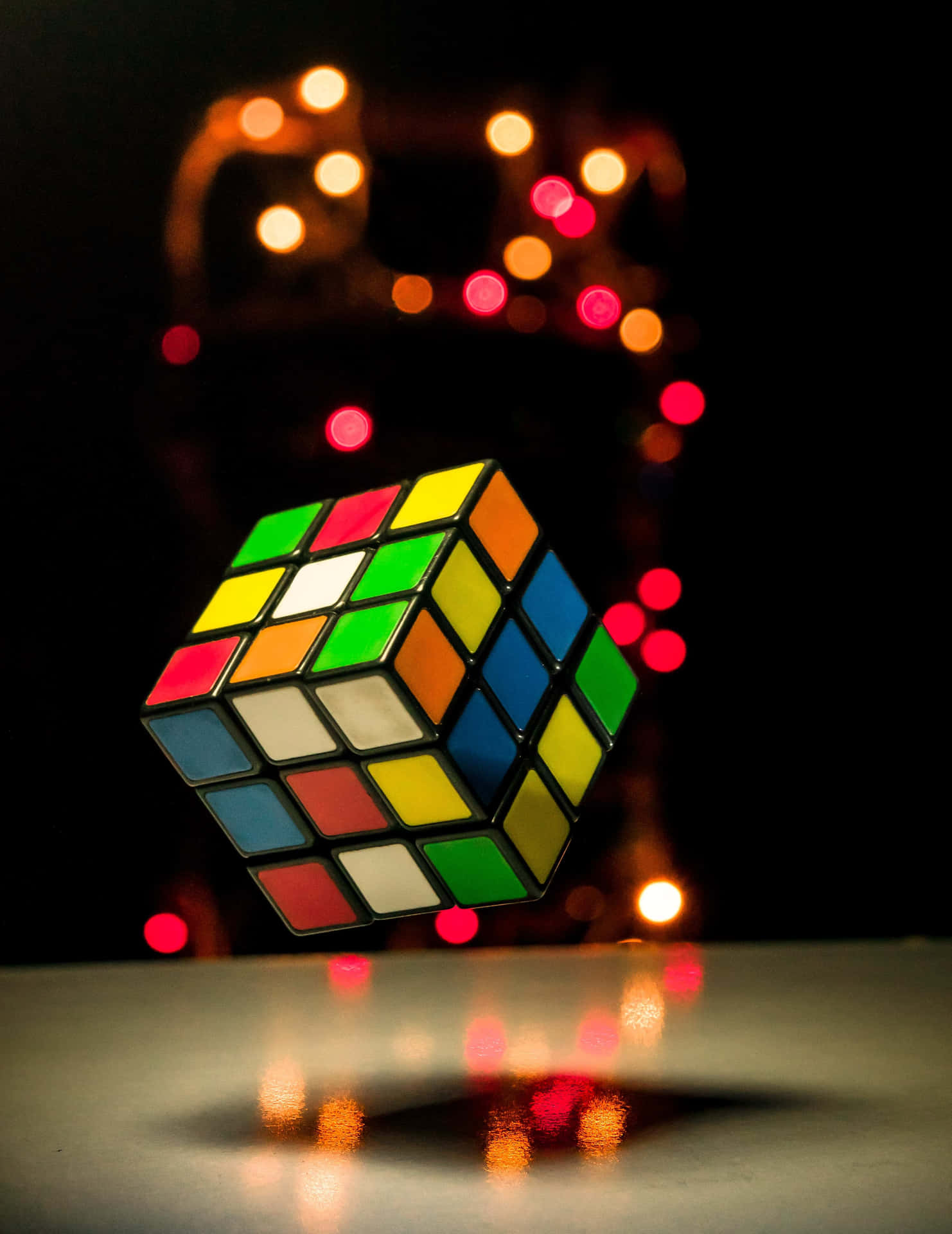 Floating Rubiks Cubewith Bokeh Lights Wallpaper