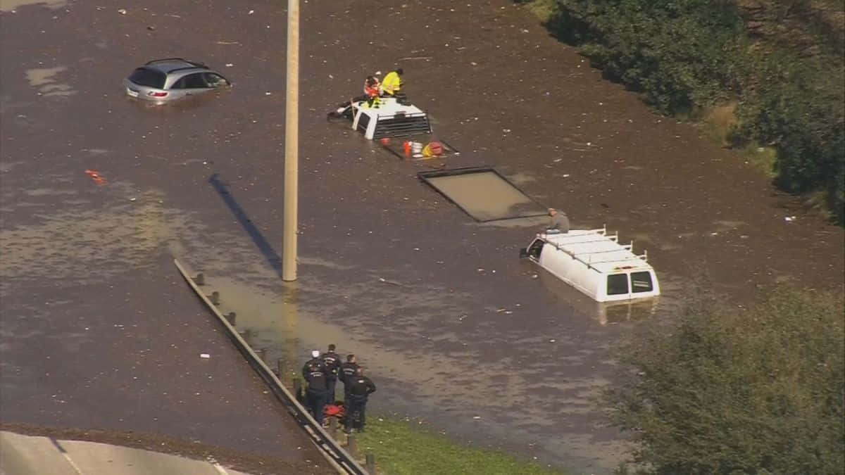 A Car Is Flooded In A Flooded Area