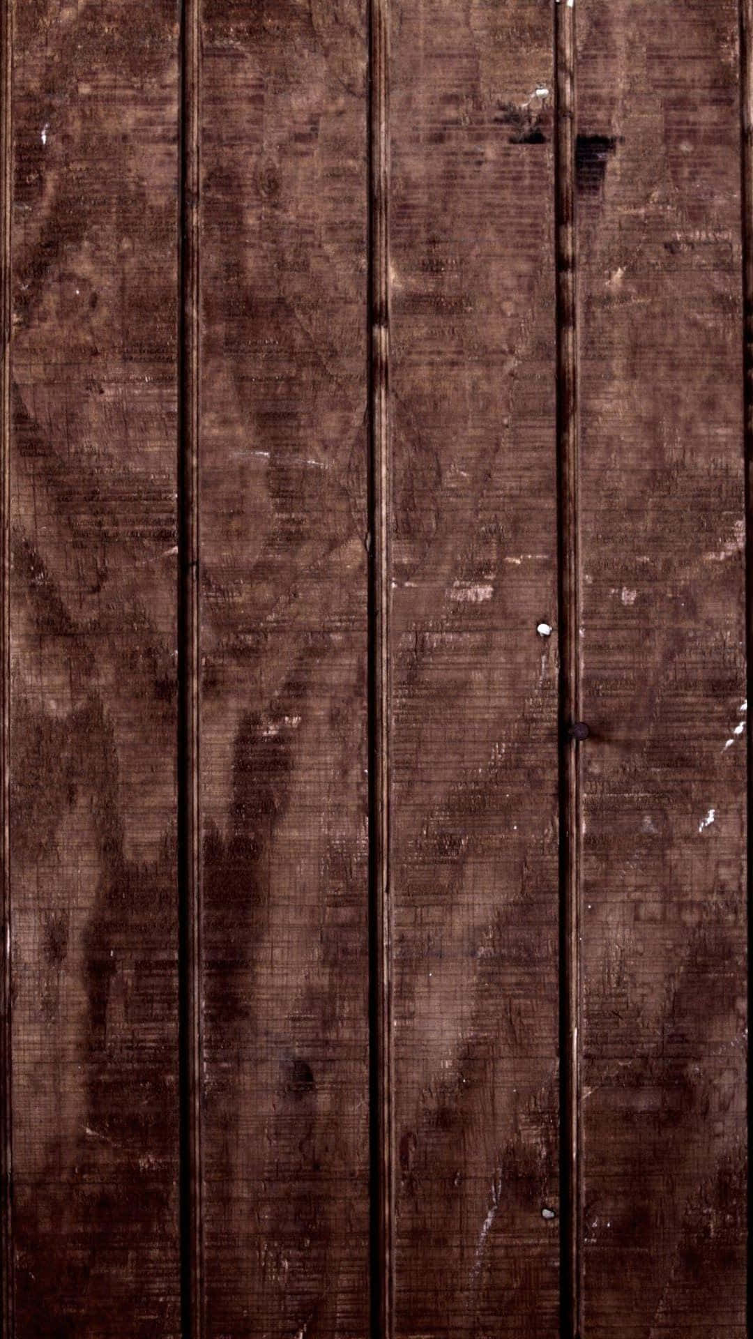 A Wooden Wall With A Brown Paint