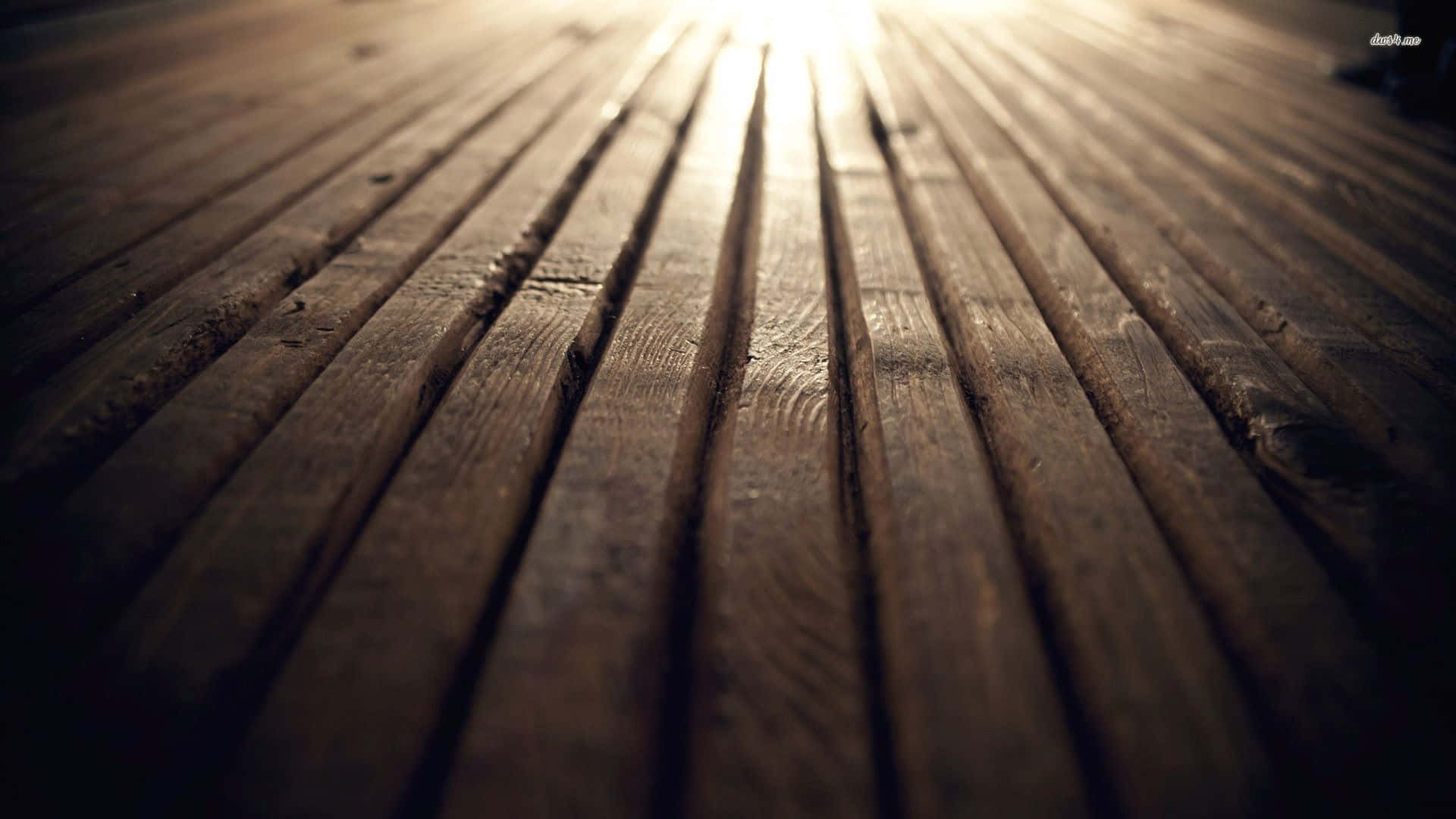 A Wooden Floor With A Light Shining On It