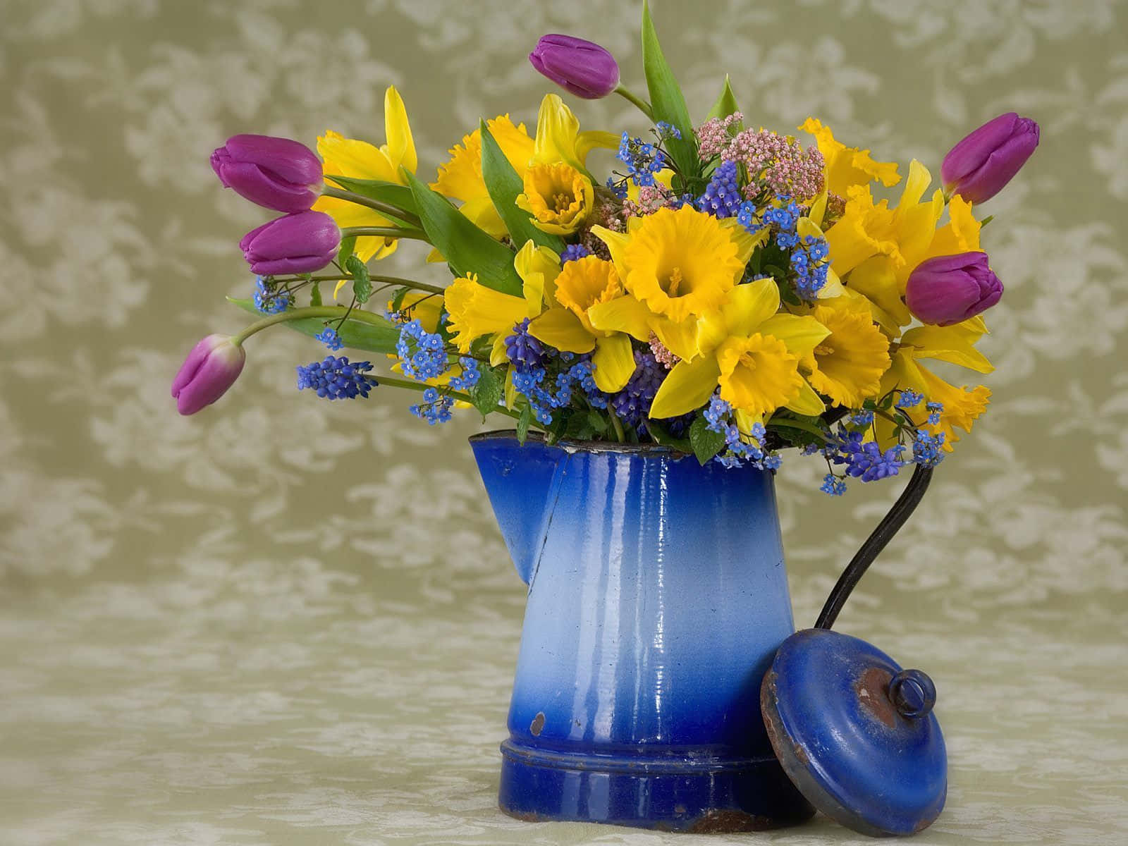 Floral Arrangement on a Table with a Candle Wallpaper