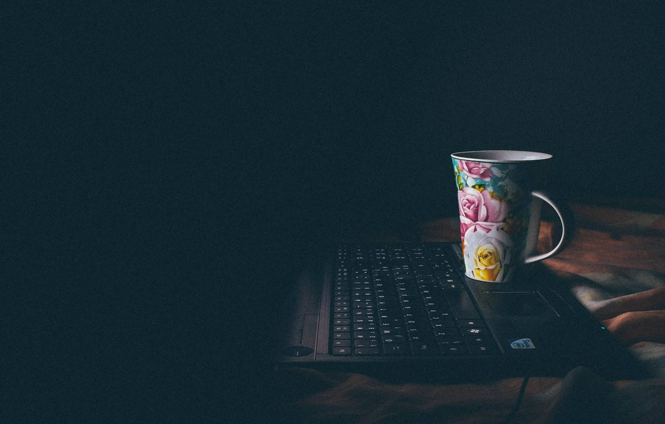 Floral Coffee Mug On Laptop Wallpaper
