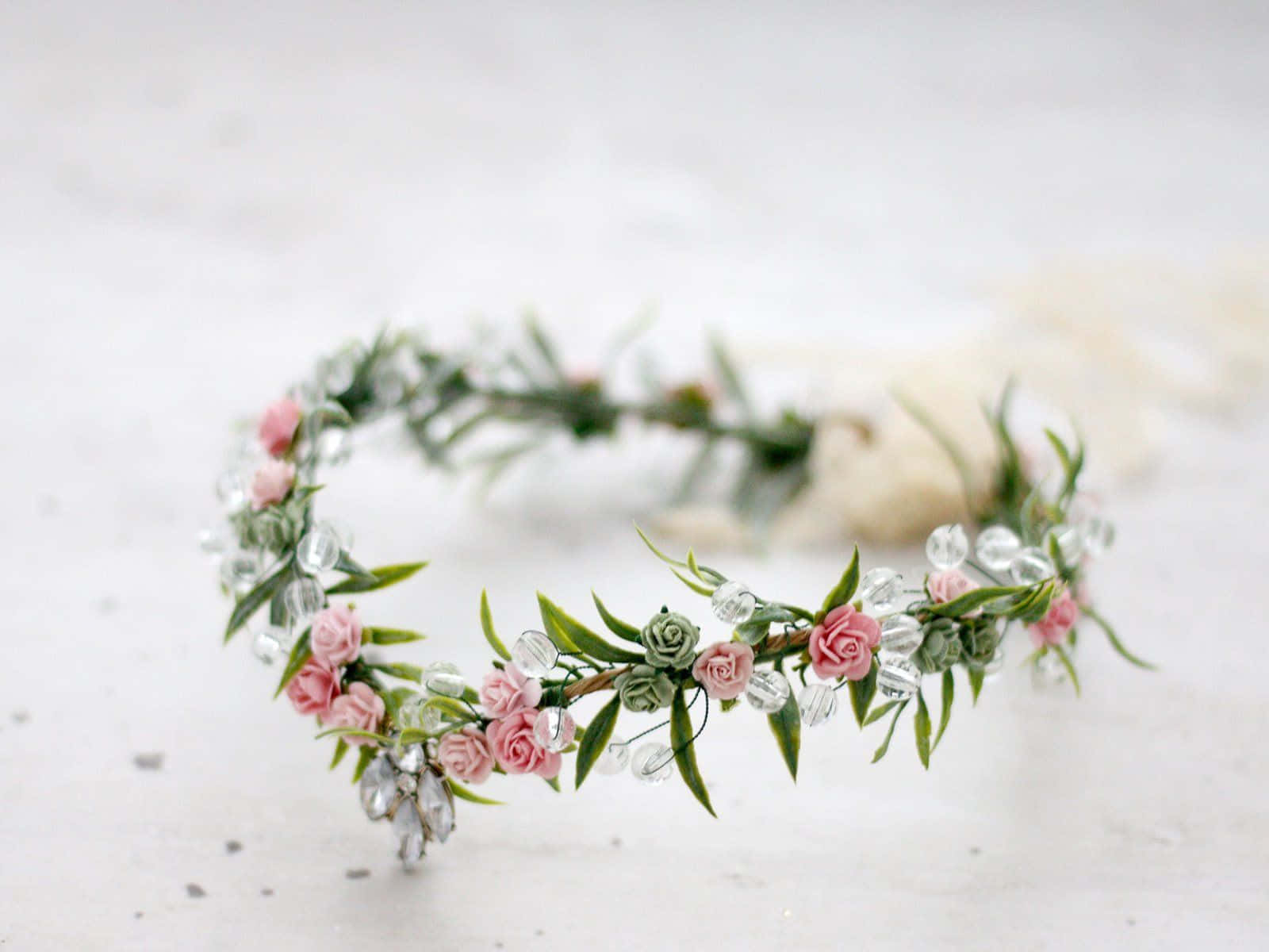 Elegant Floral Crown on a Bright Table Wallpaper
