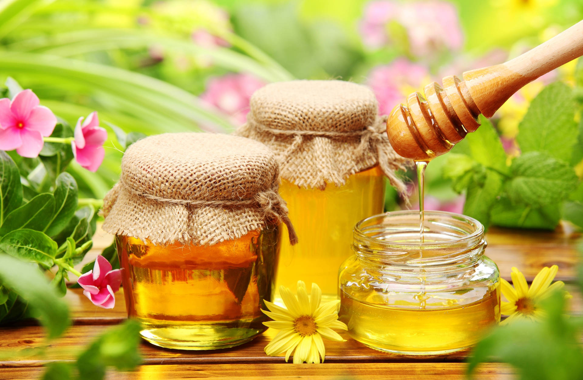 Floral Table Of Honey Jars Wallpaper