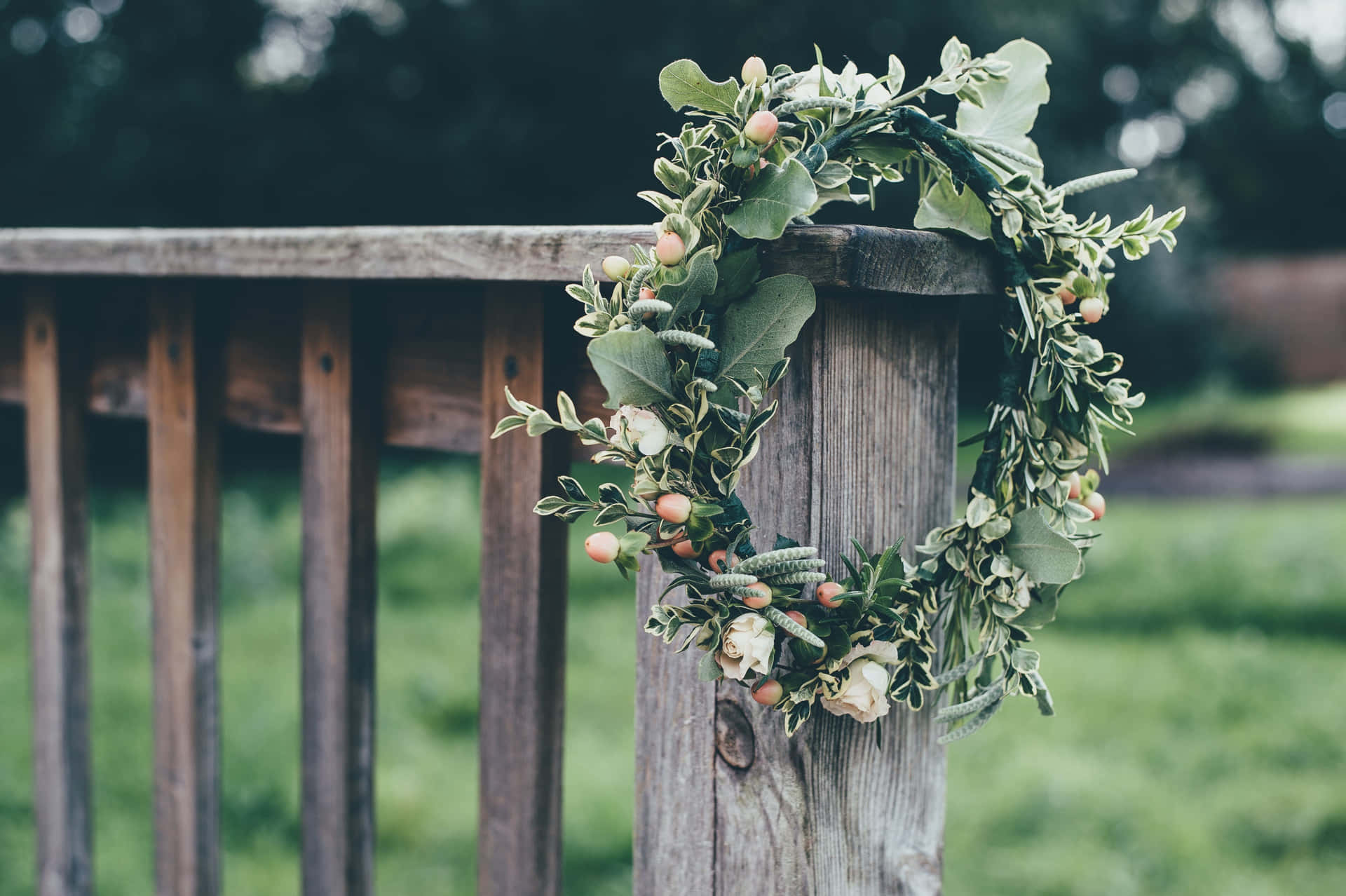 Caption: Vibrant Floral Wreath with a Variety of Blooms and Foliage Wallpaper