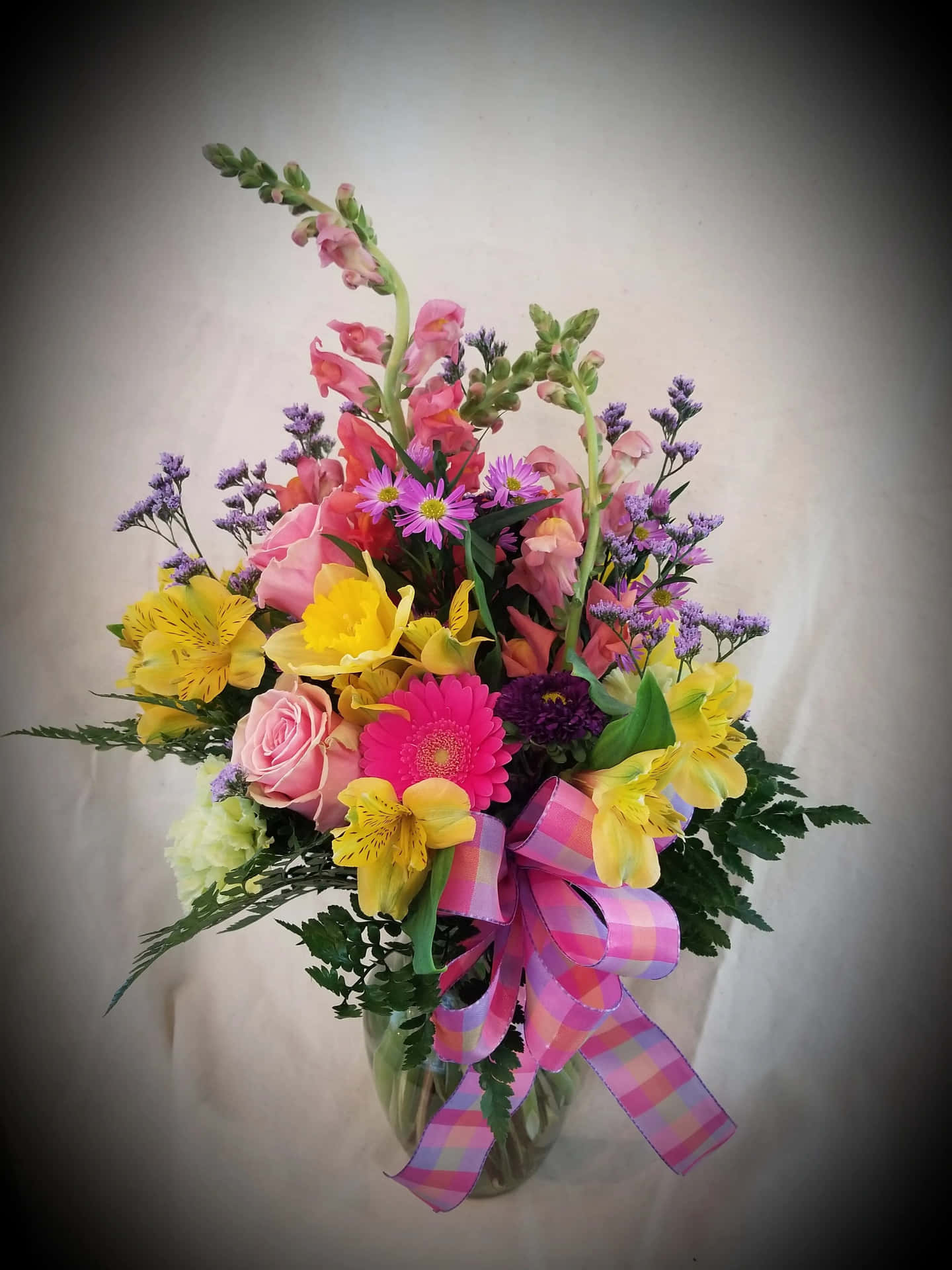 A Colorful Arrangement Of Flowers In A Vase