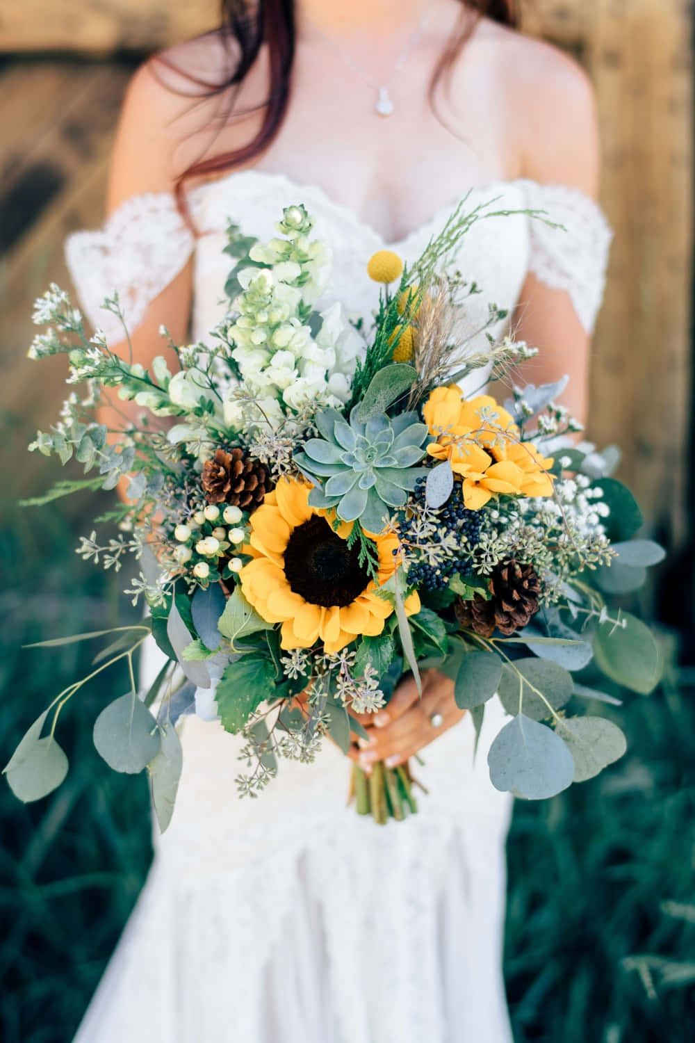 A Bride Holding A Sunflower Bouquet