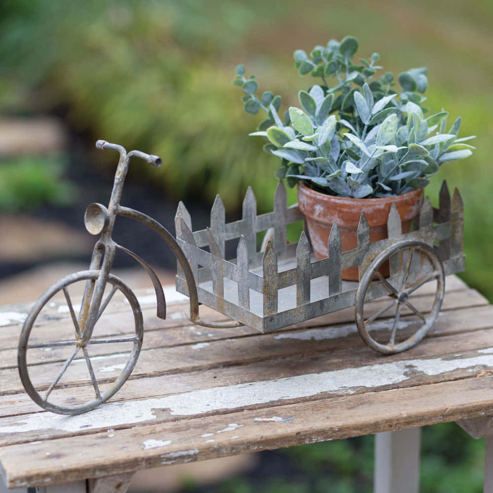 Charming Flower Cart in a Blooming Garden Wallpaper