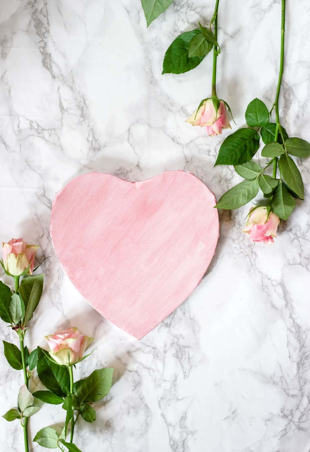 Pink Heart Shaped Paper On Marble Background With Roses