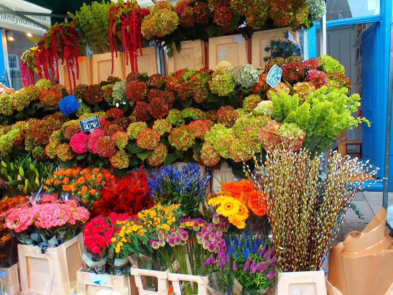Bustling Flower Market Scene Wallpaper