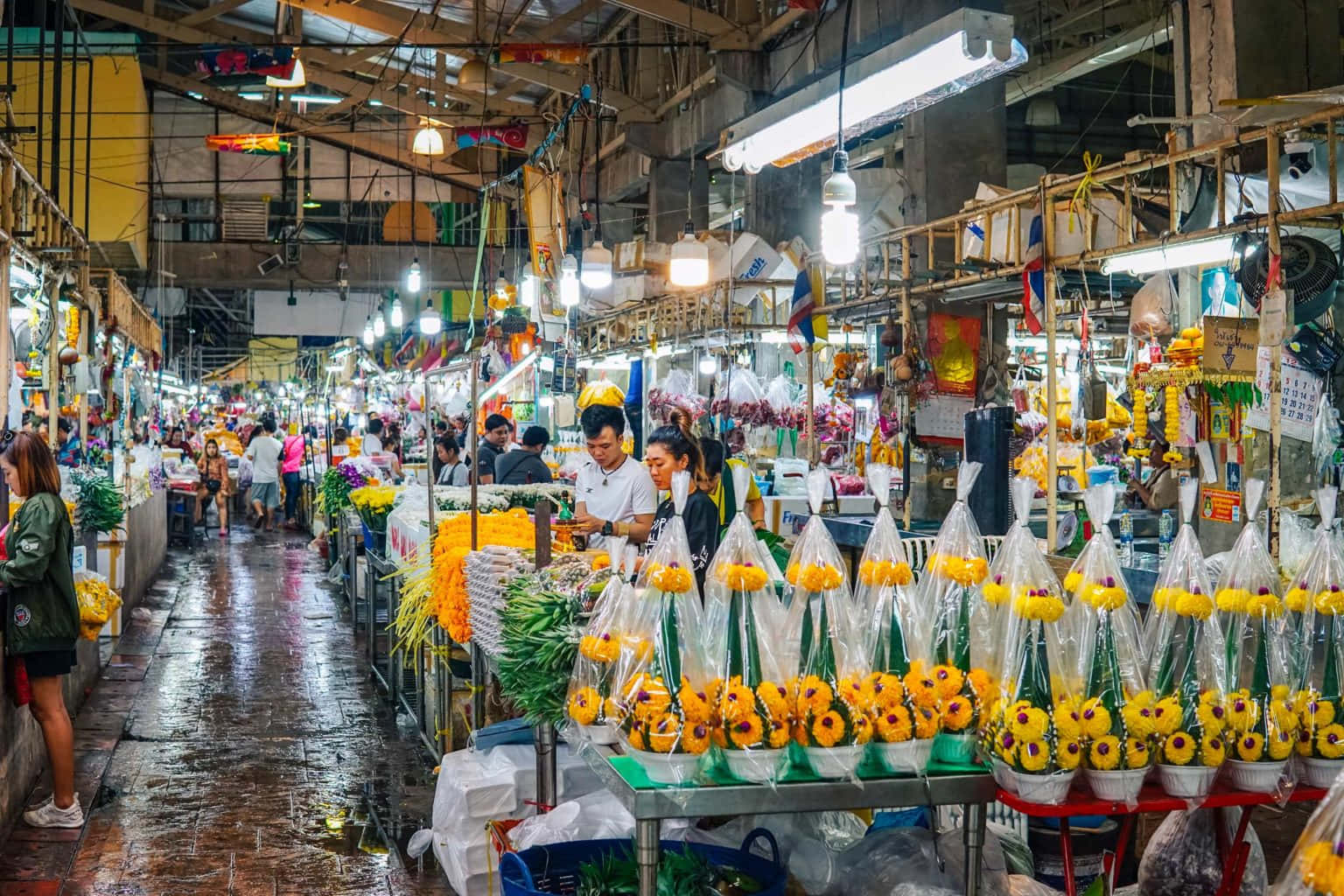Colorful Flowers at a Lively Market Wallpaper