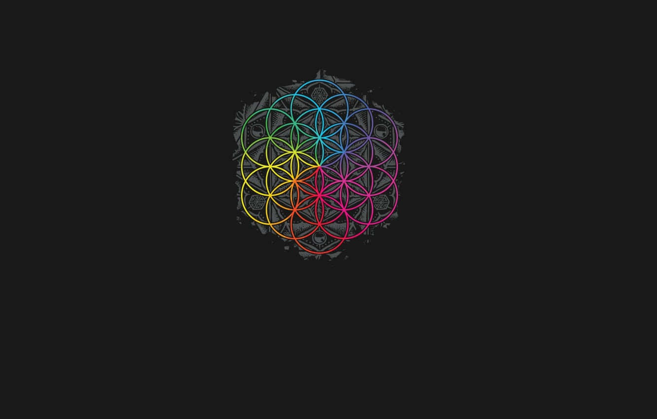 A Colorful Flower Of Life Logo On A Black Background Wallpaper