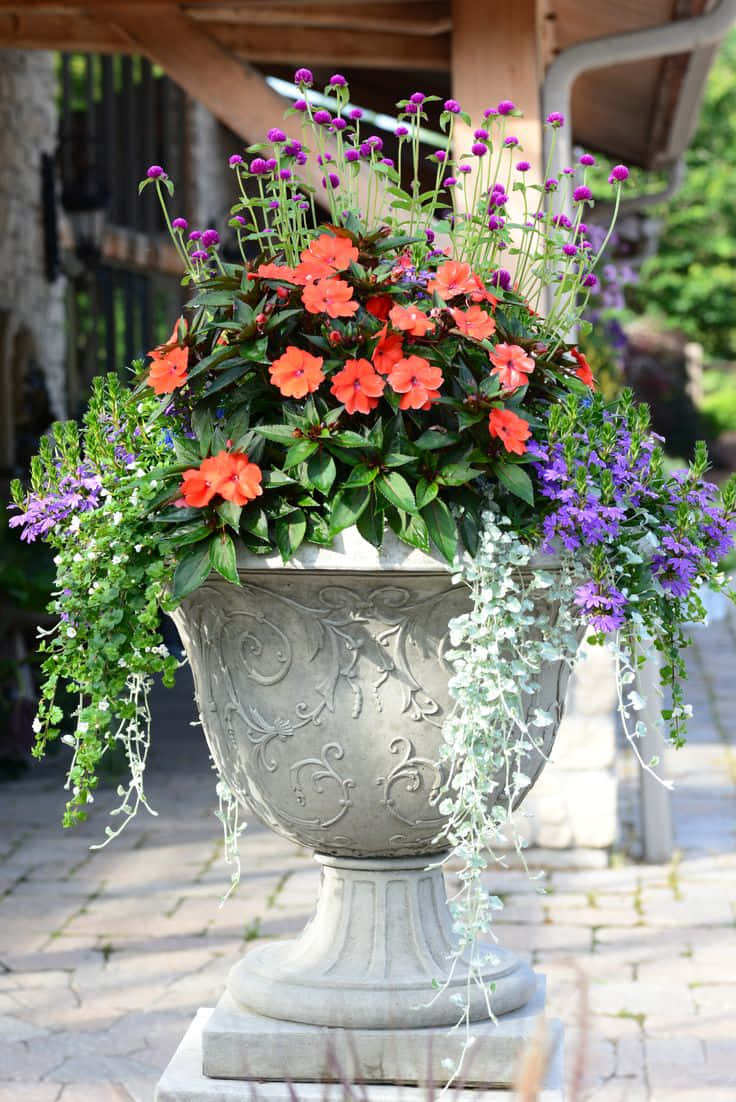 A Large Urn With Flowers In It