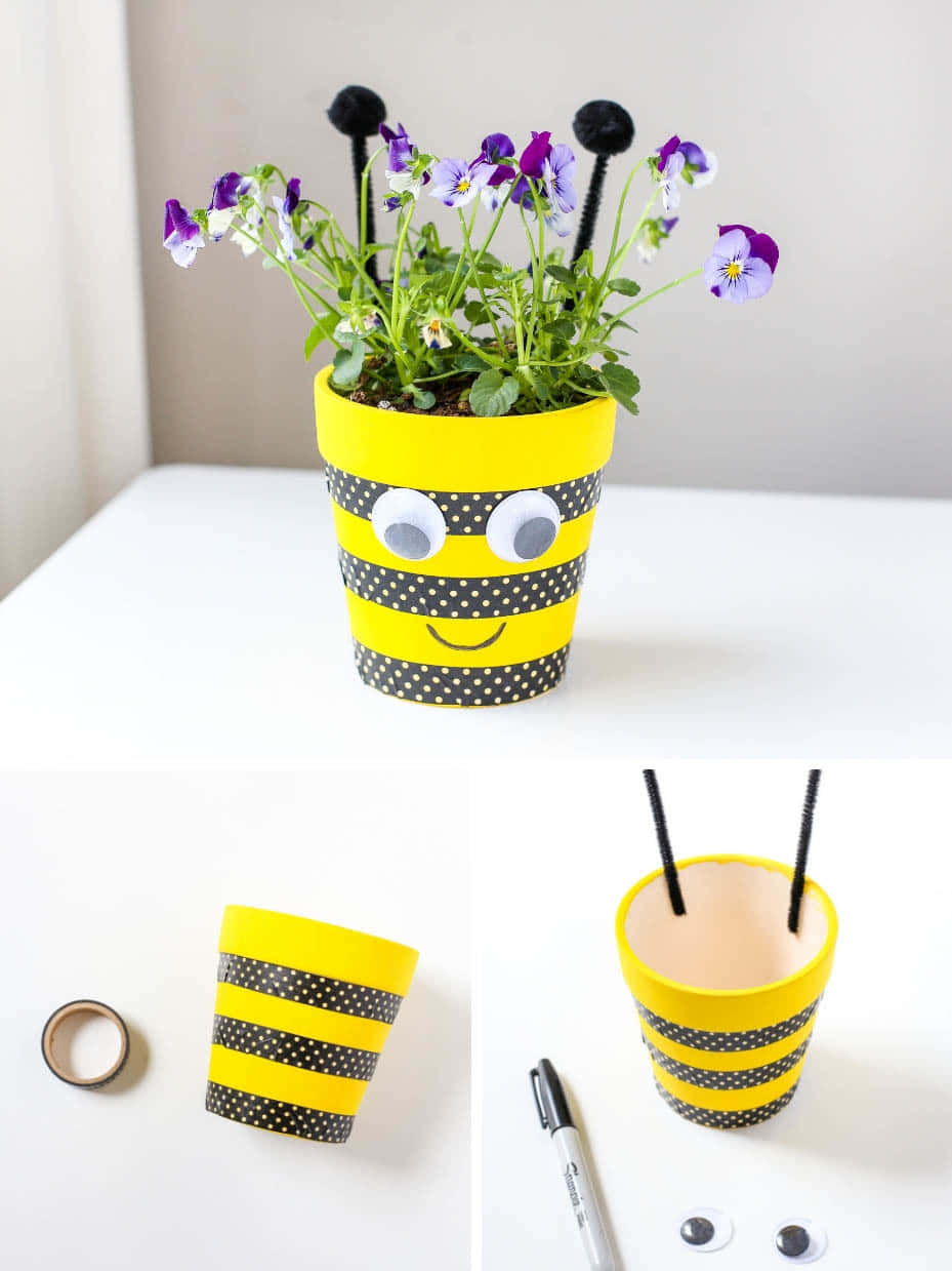 A Bee Planter With A Flower And A Pencil