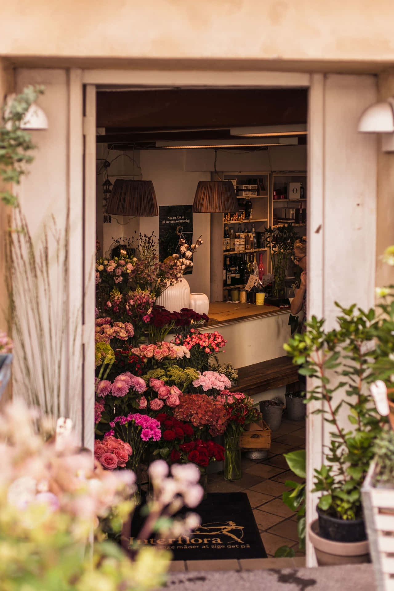 Blooming flower shop with a colorful bouquet display Wallpaper