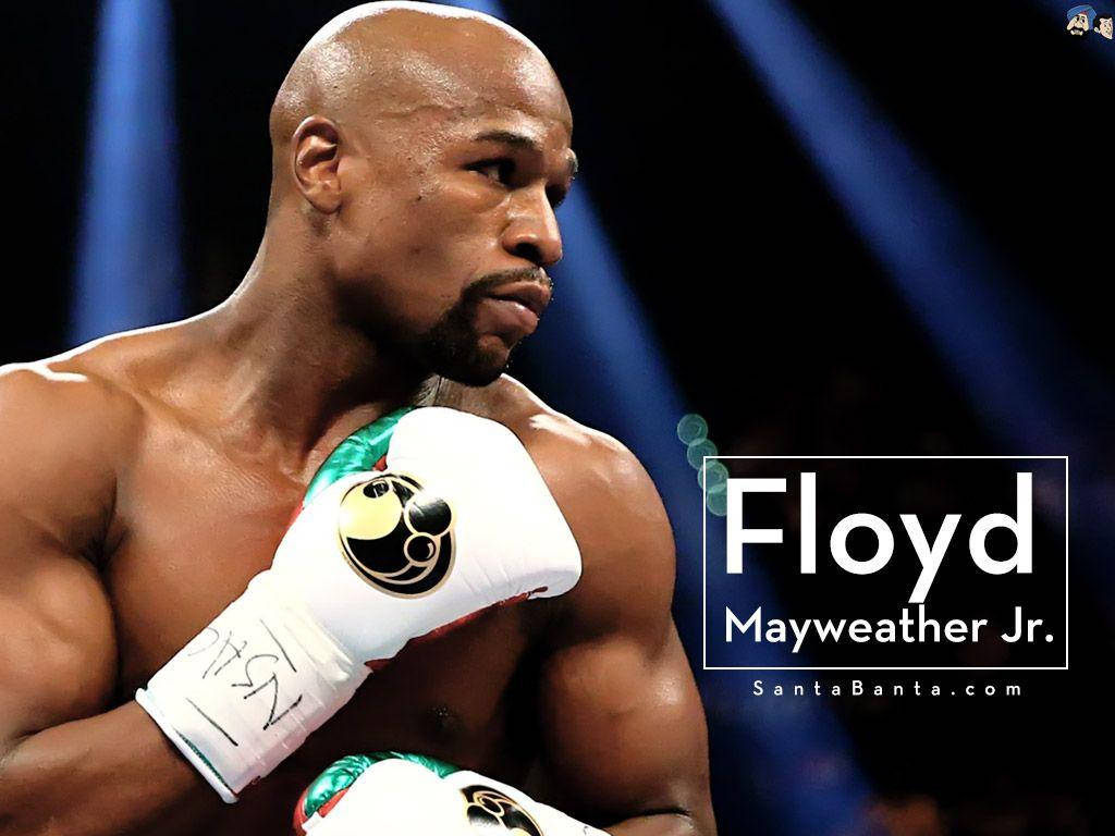Floyd Mayweather proudly showcasing his white boxing gloves Wallpaper