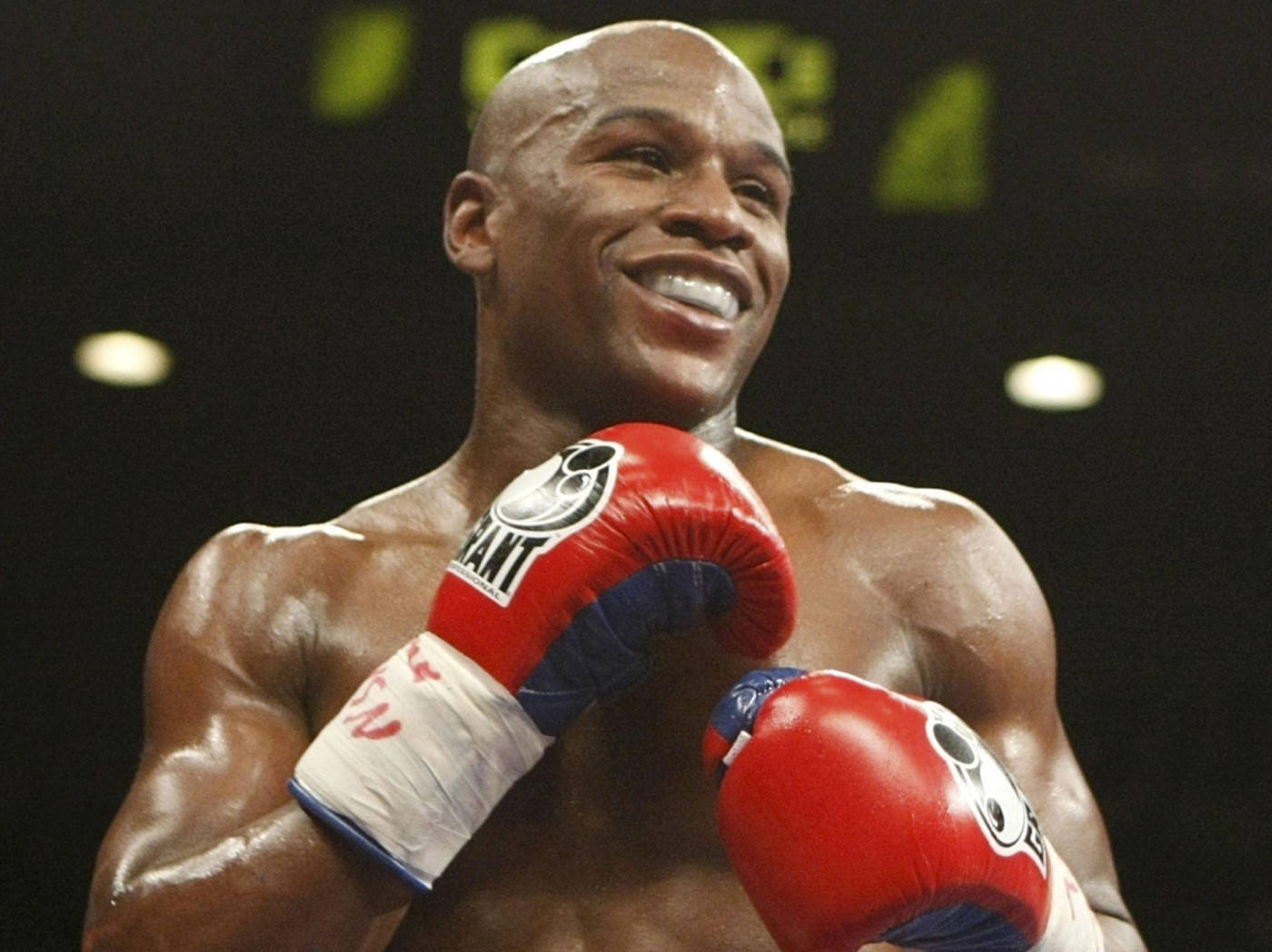 Floyd Mayweather Smiling Red Boxing Gloves Wallpaper