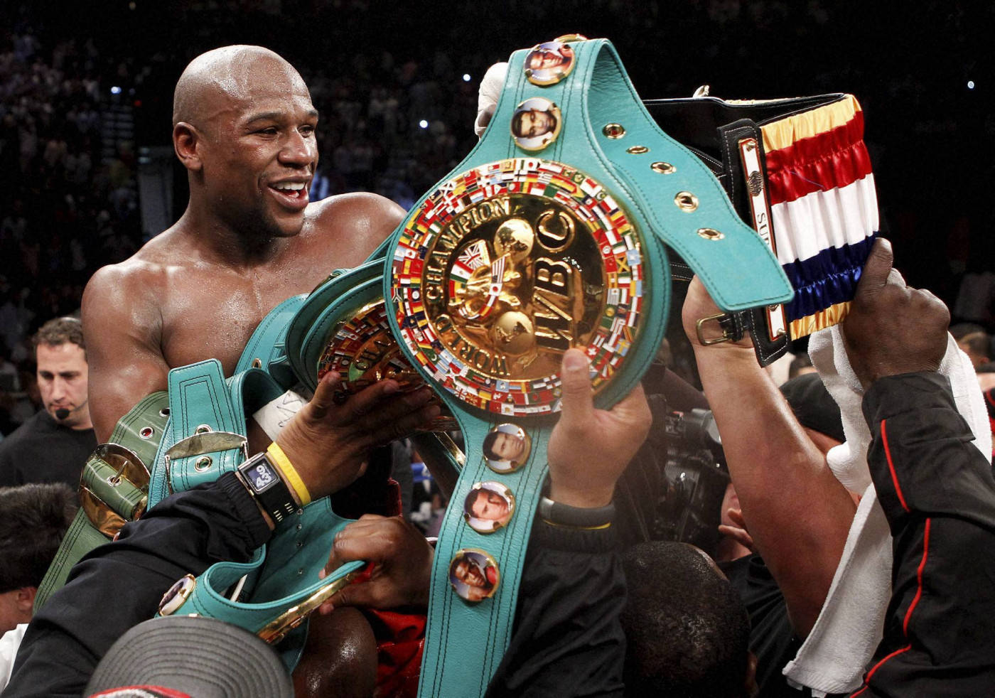 Floyd Mayweather With Multiple Champion Belts Wallpaper