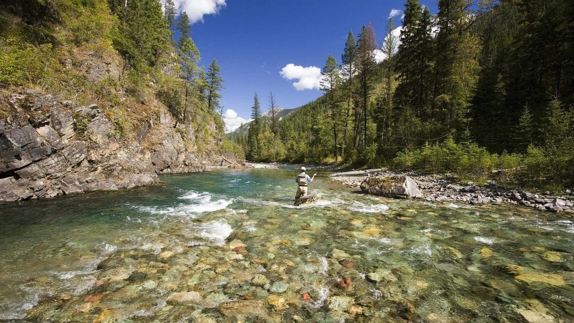 Relax and enjoy the peacefulness of fly fishing Wallpaper