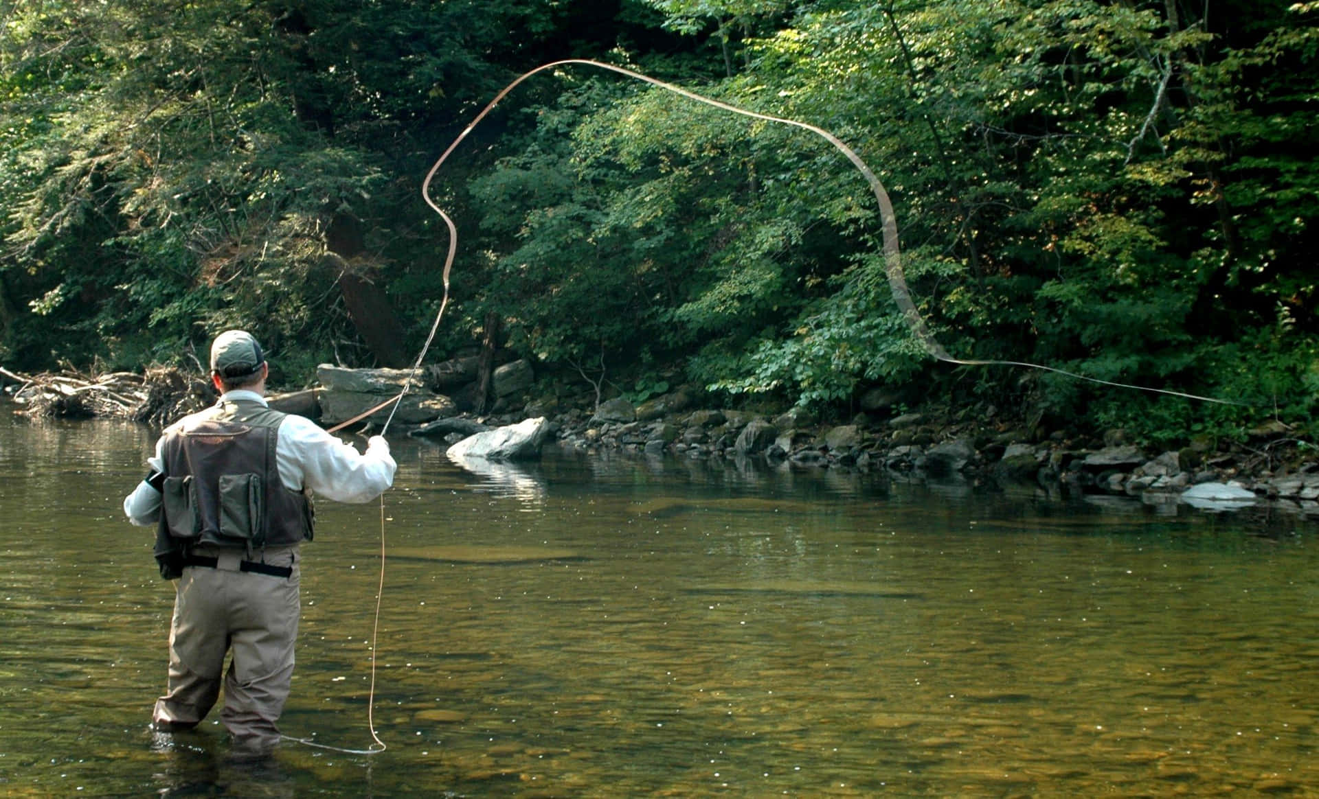 An Angler Enjoys a Day Fly Fishing Wallpaper