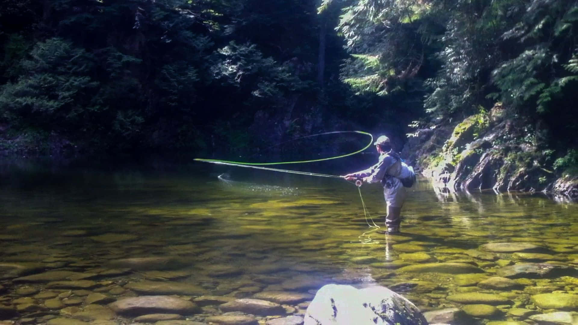 Experience the peacefulness of fly fishing through the beauty of nature Wallpaper