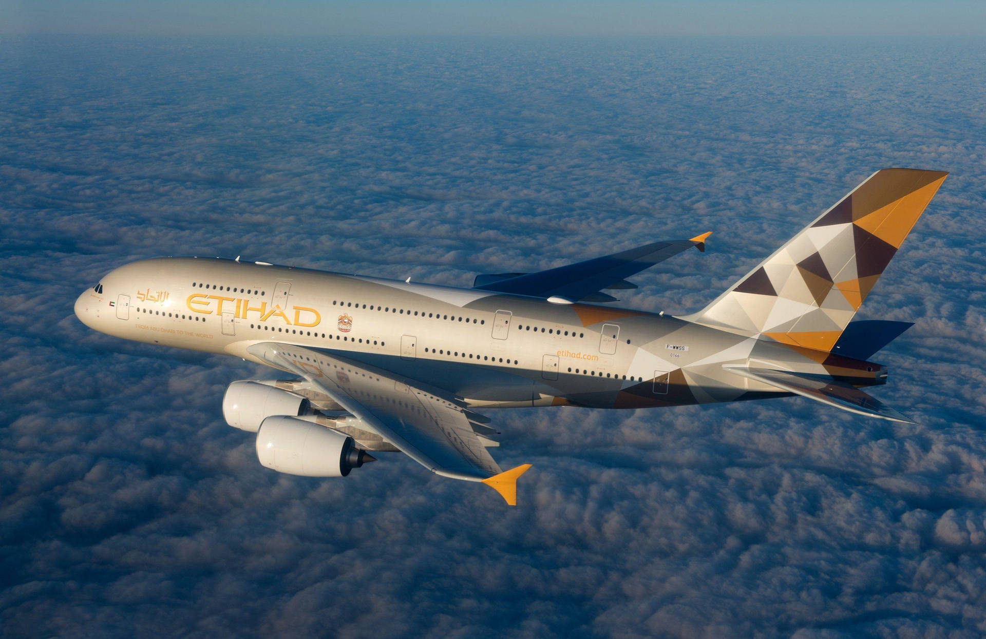 Flying Etihad Airplane Over The Clouds Wallpaper