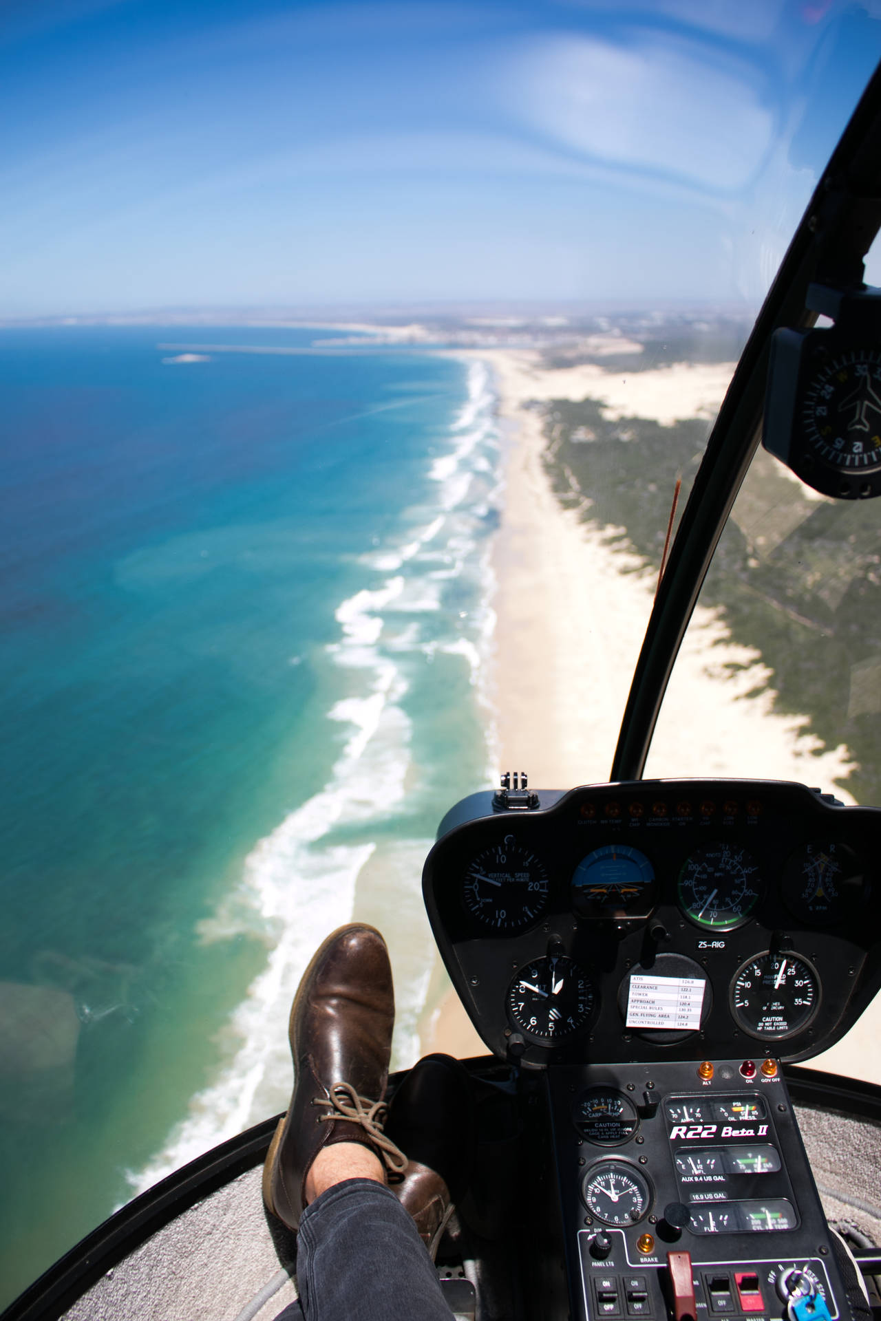 Flying Helicopter Along The Beach Wallpaper