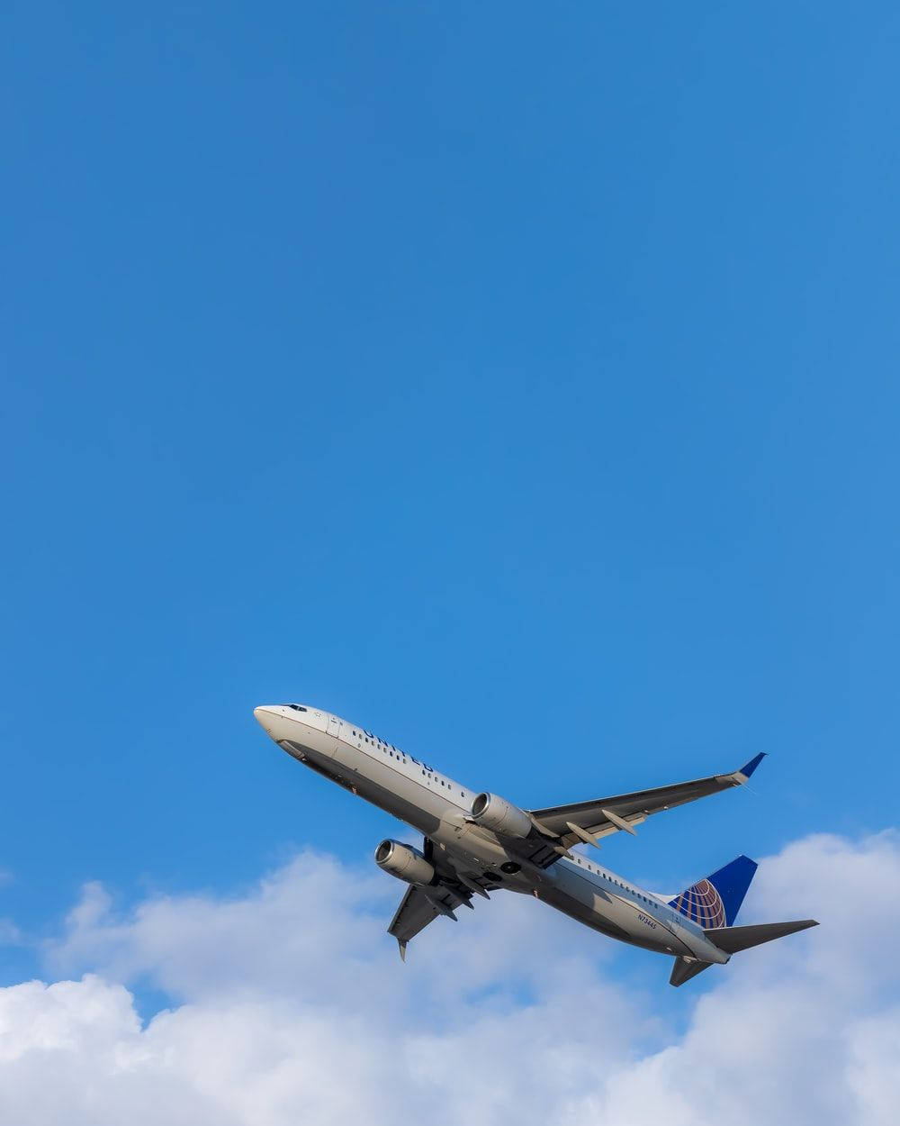 Flying White And Blue Airplane Android Background